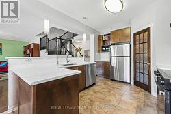 Kitchen towards open stair to above - 