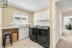 Hand upstairs laundry area - 