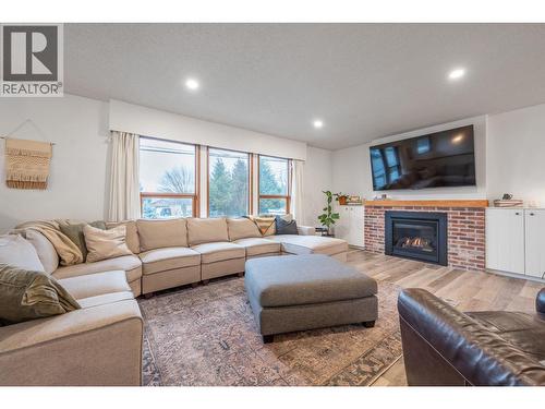 Main Home - Living Room - 302 Bass Avenue, Enderby, BC - Indoor Photo Showing Living Room With Fireplace