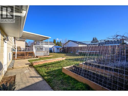Fully Fenced Backyard - 302 Bass Avenue, Enderby, BC - Outdoor With Deck Patio Veranda
