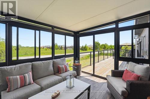 beautiful enclosed back porch - 8 Dorchester Drive, Prince Edward County (Wellington), ON - Indoor Photo Showing Living Room