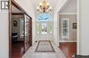 Foyer featuring a grand arched transom window, a chandelier, tile flooring, and a decorative front door with sidelights - 20 Bonniewood Drive, Drayton, ON  - Indoor Photo Showing Other Room 