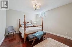 Rich wood-finish flooring complements the neutral wall tones - 