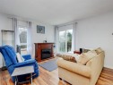 #406-3258 Alder St, Saanich, BC  - Indoor Photo Showing Living Room With Fireplace 