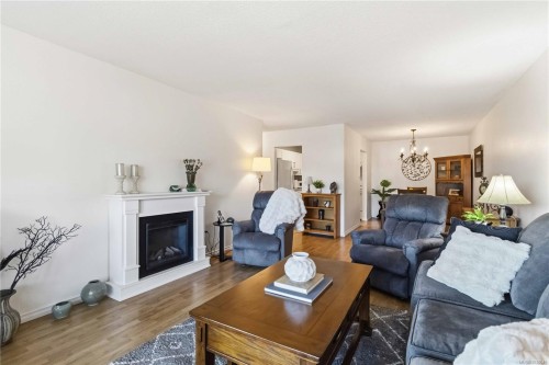 #203-1665 Oak Bay Ave, Victoria, BC - Indoor Photo Showing Living Room With Fireplace