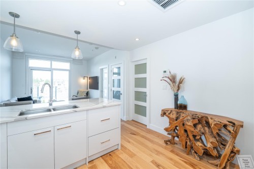 #408-916 Lyall St, Esquimalt, BC - Indoor Photo Showing Kitchen With Double Sink