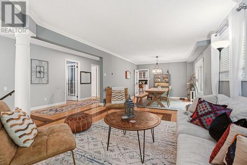 Bright living area with hardwood & large windows - 149 Cove Crescent, Hamilton, ON - Indoor Photo Showing Living Room