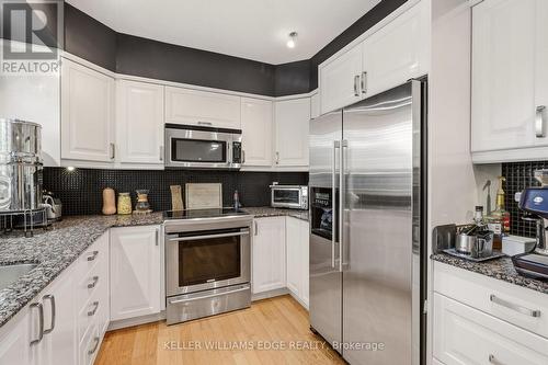 Updated kitchen w/ SS appliances & breakfast bar - 149 Cove Crescent, Hamilton, ON - Indoor Photo Showing Kitchen With Stainless Steel Kitchen With Upgraded Kitchen