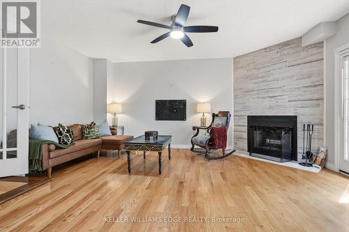 Bright family room w/ fireplace & deck/pool access - 149 Cove Crescent, Hamilton, ON - Indoor Photo Showing Living Room With Fireplace