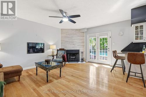 Bright family room w/ fireplace & deck/pool access - 149 Cove Crescent, Hamilton, ON - Indoor Photo Showing Living Room With Fireplace