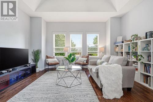 Bright 2nd-floor den w fireplace & large windows - 149 Cove Crescent, Hamilton, ON - Indoor Photo Showing Living Room