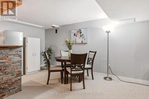Basement rec room w/ wet bar & stone accent wall - 149 Cove Crescent, Hamilton, ON - Indoor Photo Showing Dining Room