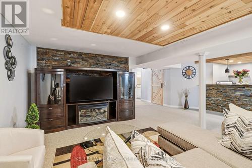 Basement rec room w/ wet bar & stone accent wall - 149 Cove Crescent, Hamilton, ON - Indoor With Fireplace