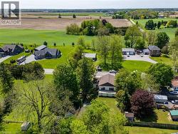 Rural setting featuring extensive green fields surrounding properties - 