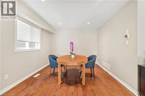Dining area featuring wood-finish flooring, neutral wall tones, and recessed ceiling lighting - 21 Davinci Boulevard, Hamilton, ON - Indoor Photo Showing Dining Room