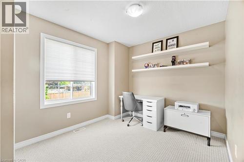 Room featuring light tan walls, white trim, and light-colored carpet - 21 Davinci Boulevard, Hamilton, ON - Indoor