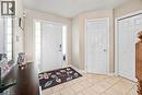 Entryway featuring a paneled front door with sidelight windows, tile flooring, and neutral wall tones - 21 Davinci Boulevard, Hamilton, ON  - Indoor Photo Showing Other Room 