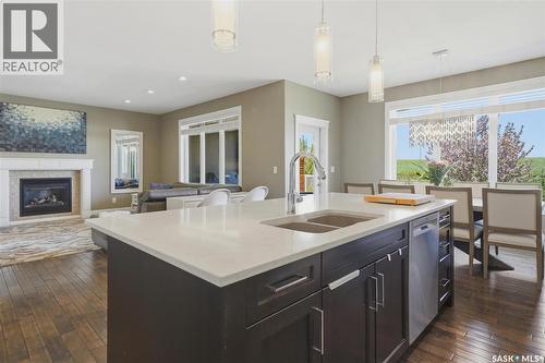 719 Salloum Crescent, Saskatoon, SK - Indoor Photo Showing Kitchen With Fireplace With Double Sink