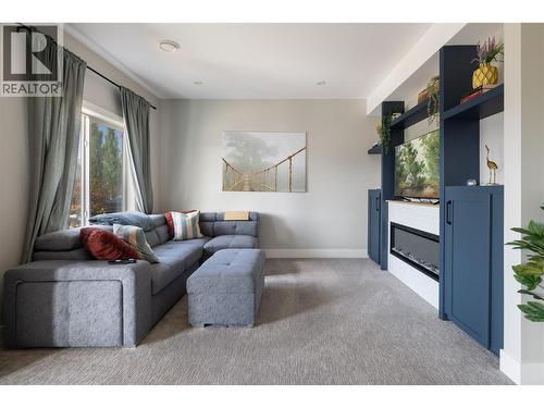 Basement Media Room - 933 Mt Robson Place Unit# 18, Vernon, BC - Indoor Photo Showing Living Room With Fireplace