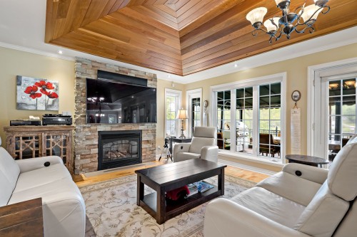 Salon - 1320 Rue De La Baie, Chertsey, QC - Indoor Photo Showing Living Room With Fireplace