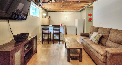 Salle familiale - 358 Rue Des Merles, Nominingue, QC - Indoor Photo Showing Basement