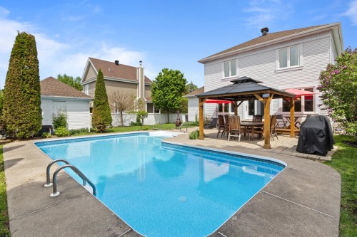 Face arrière - 14 Rue St-Onge, Châteauguay, QC - Outdoor With In Ground Pool With Backyard