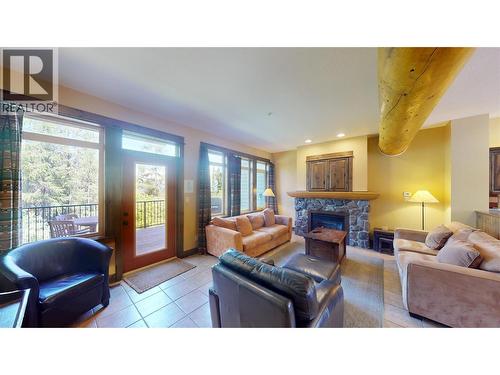 1351 Gerry Sorensen Way Unit# J2-B, Kimberley, BC - Indoor Photo Showing Living Room With Fireplace