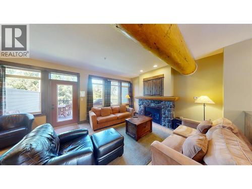 1351 Gerry Sorensen Way Unit# J2-B, Kimberley, BC - Indoor Photo Showing Living Room With Fireplace