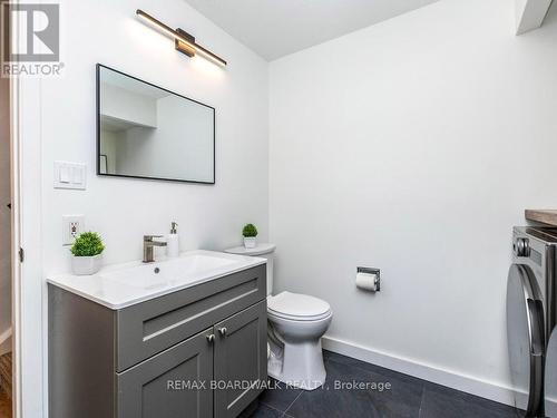 Beautifully renovated Bath & Laundry Room by Foyer - 41 Putman Avenue, Ottawa, ON - Indoor Photo Showing Bathroom