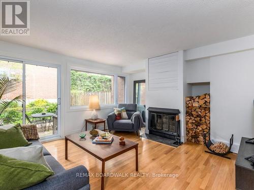 Wood Buring Fireplace in Living Room - 41 Putman Avenue, Ottawa, ON - Indoor Photo Showing Living Room With Fireplace