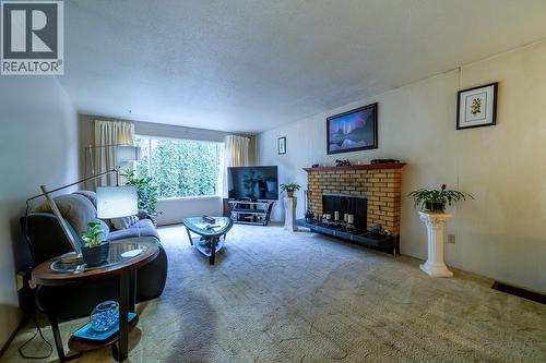 1835 Westsyde Road, Kamloops, BC - Indoor Photo Showing Living Room With Fireplace