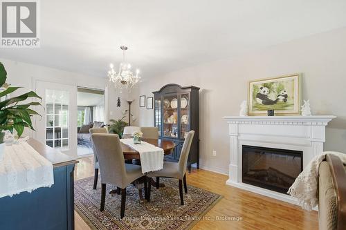 32 Andrew Drive, Kawartha Lakes (Lindsay), ON - Indoor Photo Showing Dining Room With Fireplace