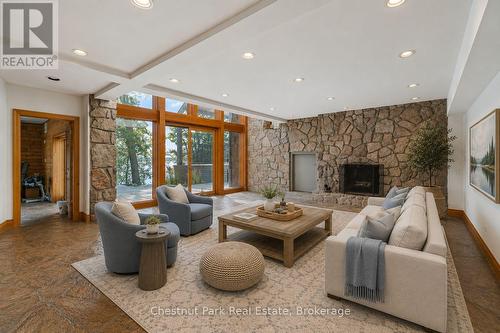 Walk-out basement, Virtually staged. - 10 Wyldewood Road, Muskoka Lakes (Monck (Muskoka Lakes)), ON - Indoor Photo Showing Living Room With Fireplace