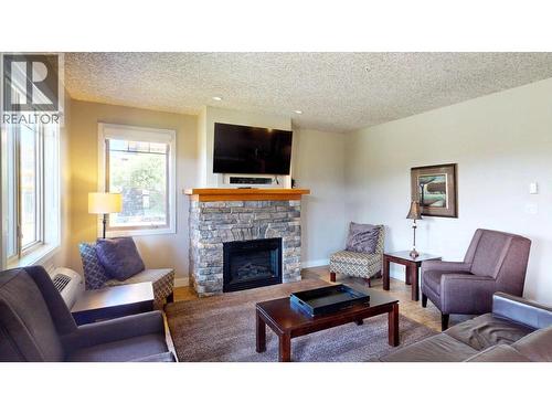 400 Bighorn Boulevard Unit# 416 K1, Radium Hot Springs, BC - Indoor Photo Showing Living Room With Fireplace