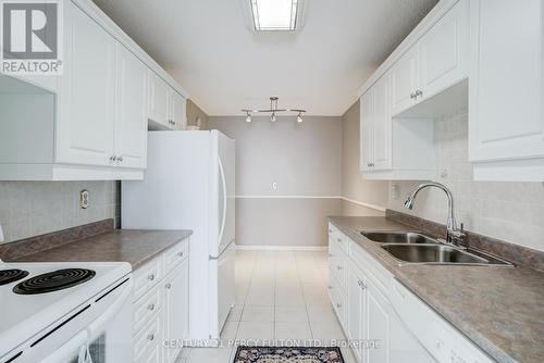 608 - 121 Trudelle Street, Toronto, ON - Indoor Photo Showing Kitchen With Double Sink