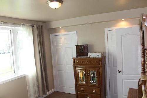 Primary bedroom complete with his and hers closets. - 387 William Street, Arborg, MB - Indoor Photo Showing Other Room