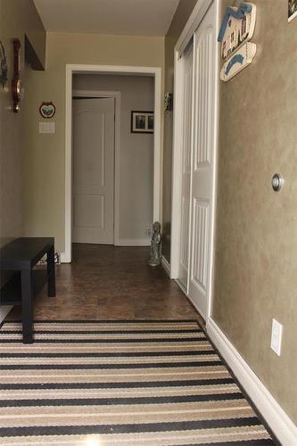 The front foyer has a large sliding closet. - 387 William Street, Arborg, MB - Indoor Photo Showing Other Room