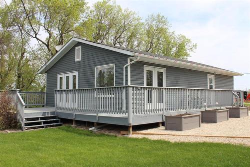 Backyard view of the house. - 387 William Street, Arborg, MB - Outdoor With Deck Patio Veranda