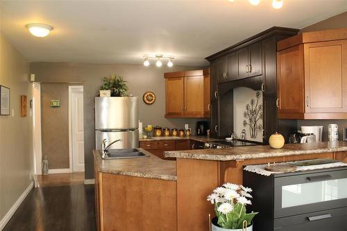 Another view of the kitchen area. Lot's of cupboards, drawers and counter space. - 387 William Street, Arborg, MB - Indoor Photo Showing Kitchen With Double Sink