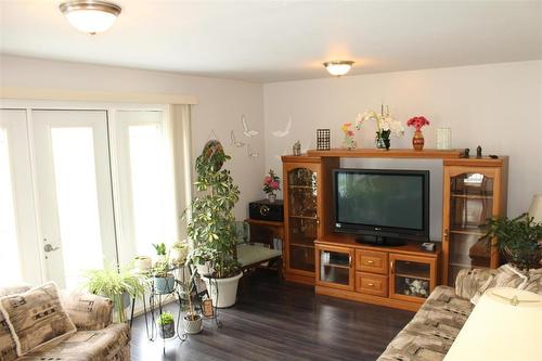 Loads of natural light coming through the garden doors leading to the deck. - 387 William Street, Arborg, MB - Indoor Photo Showing Living Room