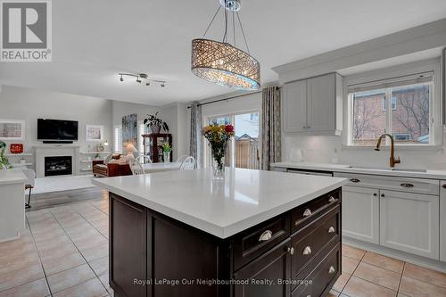 24 Kingham Avenue, Ajax (South East), ON - Indoor Photo Showing Kitchen With Fireplace