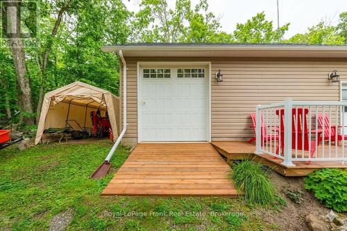 AI Generated - 25 Lakeland Avenue, Trent Lakes, ON - Outdoor With Deck Patio Veranda With Exterior