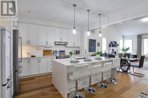 waterfall island design - 5 Hunter Place, Bracebridge (Macaulay), ON - Indoor Photo Showing Kitchen With Upgraded Kitchen