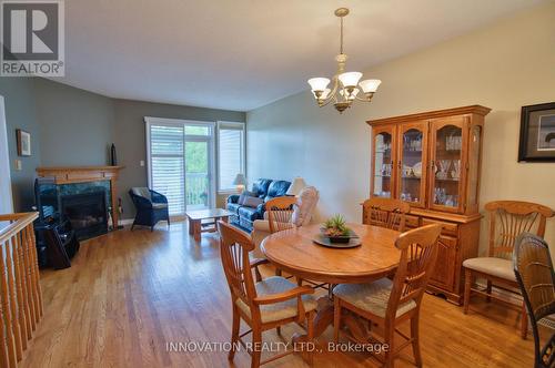 27 Eileen Crescent, Ottawa, ON - Indoor Photo Showing Dining Room With Fireplace