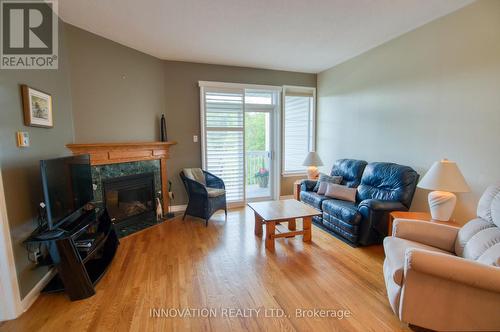 27 Eileen Crescent, Ottawa, ON - Indoor Photo Showing Living Room With Fireplace