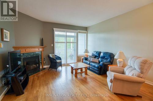 27 Eileen Crescent, Ottawa, ON - Indoor Photo Showing Living Room With Fireplace