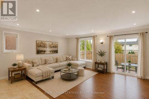 Family Room/Backyard - Virtual Staged - 35 Trenholme Crescent, Hamilton, ON - Indoor Photo Showing Living Room