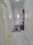 Ample room for a coat/shoe and hallway bench. - 
