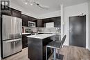 106 545 Hassard Close, Saskatoon, SK  - Indoor Photo Showing Kitchen With Stainless Steel Kitchen With Upgraded Kitchen 