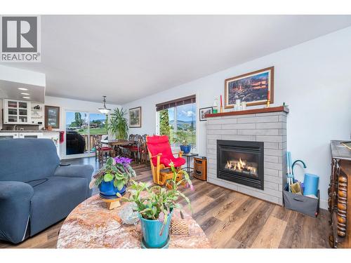 6485 Cardinal Road, Vernon, BC - Indoor Photo Showing Living Room With Fireplace